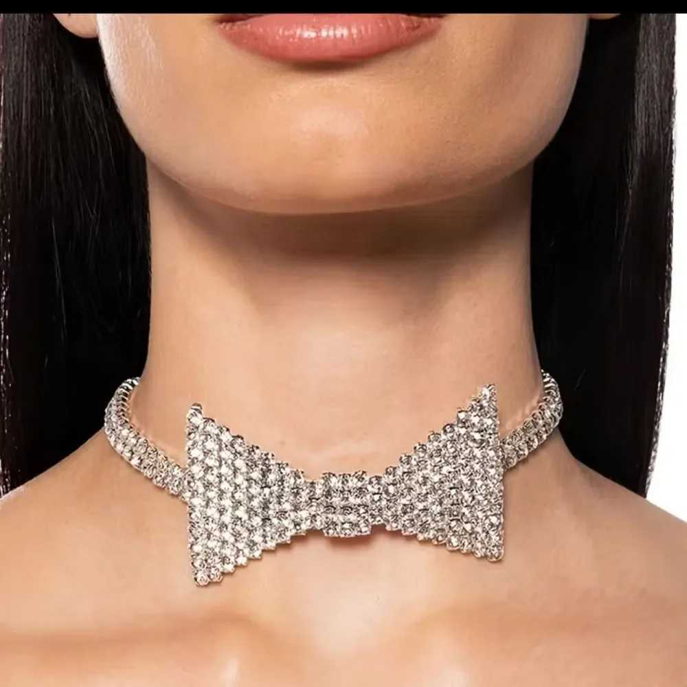 Dazzling crystal bow centerpiece on a sparkling choker. Elegant, eye-catching.